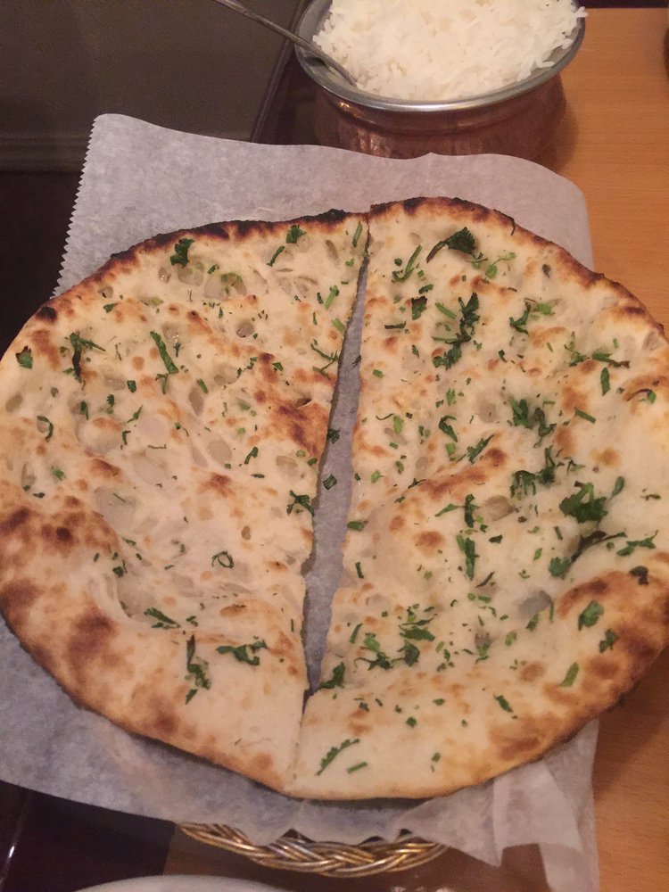 Order 119. Onion Kulcha food online from New Sizzling Tandoor store, Santa Rosa on bringmethat.com