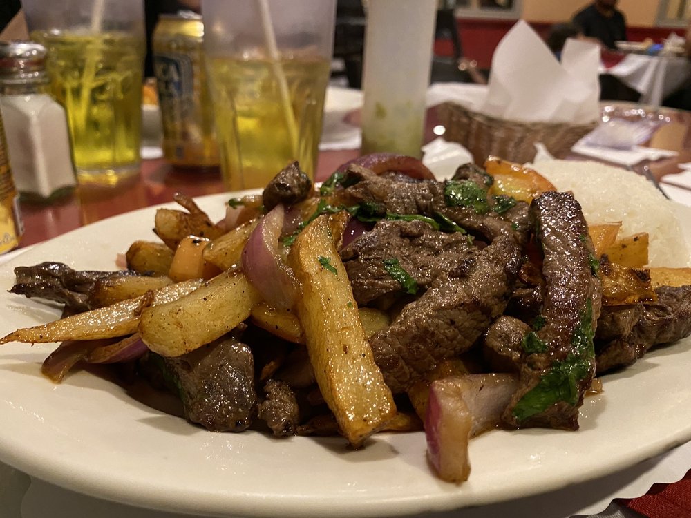Order 14. LOMO SALTADO food online from Mario's Peruvian & Seafood store, Los Angeles on bringmethat.com
