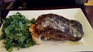 Order Kona Coffee Crusted Ribeye* food online from Tommy Bahama Restaurant, Bar & Store store, Sarasota on bringmethat.com