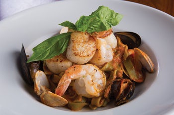 Order GF Fettuccini di Mare food online from Biaggi's store, Maple Grove on bringmethat.com
