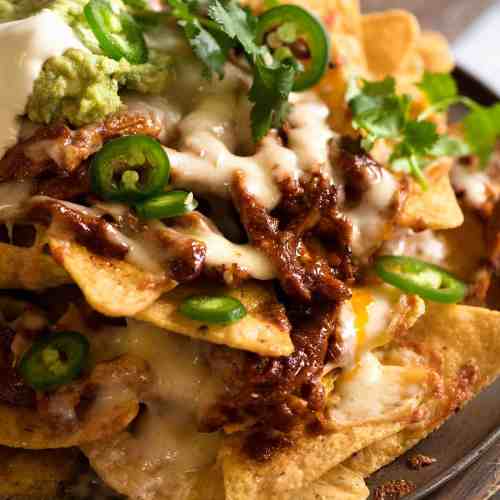 Order Chicken & Cheese Nachos food online from La Fiesta Mexican Restaurant store, Greenville on bringmethat.com