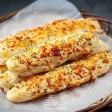 Order Bread Sticks with Cheese. food online from New Brother's Pizza store, Fishersville on bringmethat.com