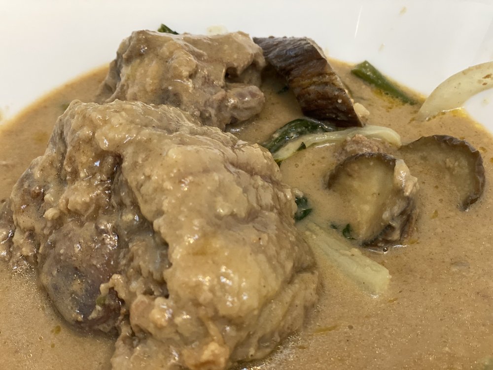 Order KareKare Oxtail food online from Tambayan Restaurant & Mart store, Portland on bringmethat.com