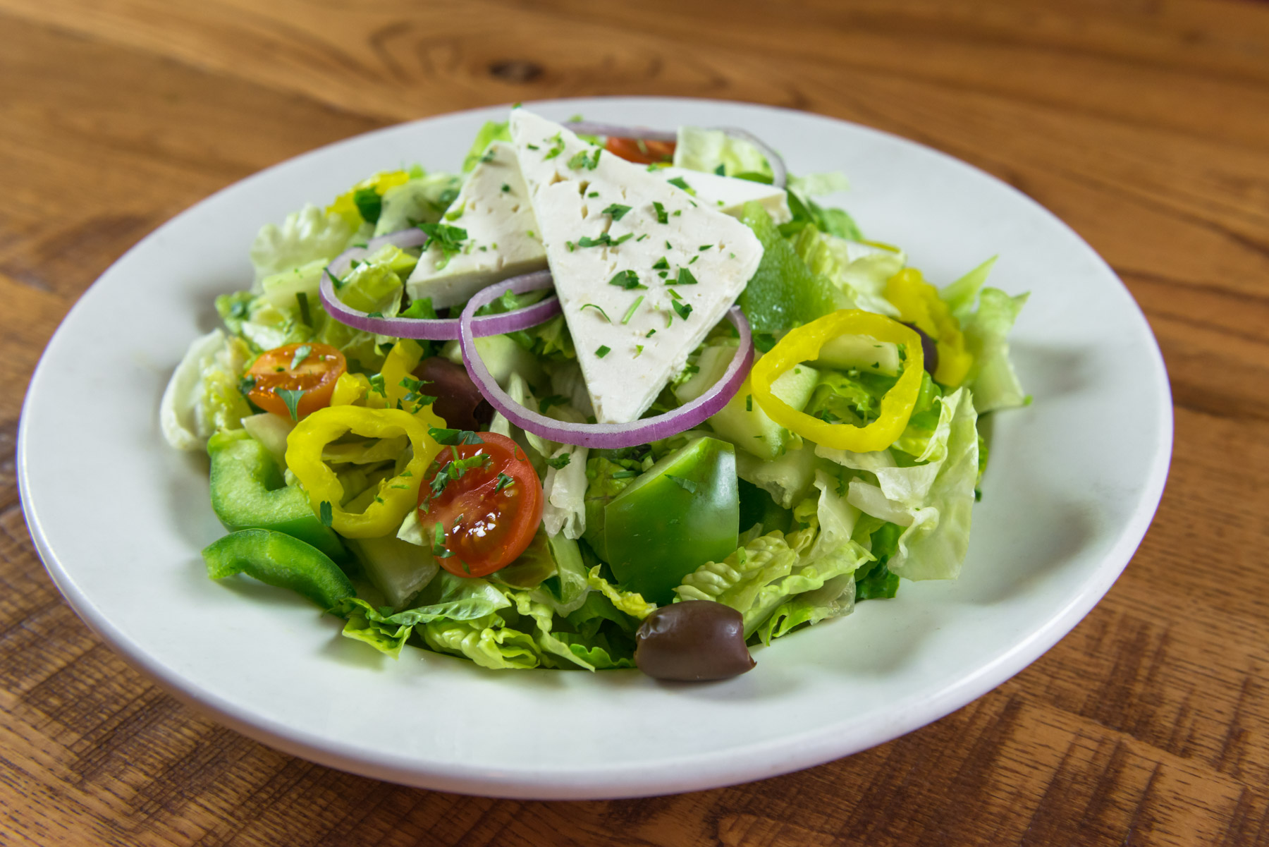 Order Greek Salad food online from 2 Guys & A Pie Pizzeria store, Bonaire on bringmethat.com