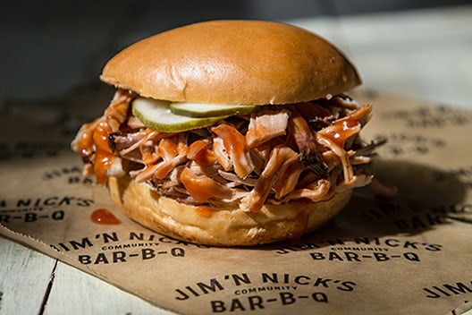 Order Pig On A Bun with 1 Trimming food online from Jim 'N Nick's Bar-B-Q store, Cordova on bringmethat.com
