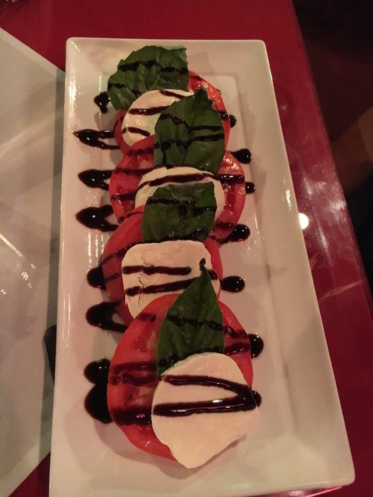 Order Caprese Salad food online from Gigis Italian Restaurant store, St Pete Beach on bringmethat.com