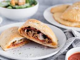 Order Meat Lover's Calzone food online from Slice of Life Pizzeria store, Sprng Hill on bringmethat.com
