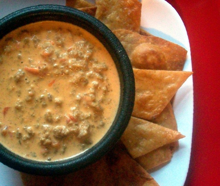 Order CHIPS & ROTEL food online from Rick's Cafe Americain store, Starkville on bringmethat.com