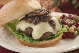Order MUSHROOM SWISS BURGER  food online from Rick's Cafe Americain store, Starkville on bringmethat.com
