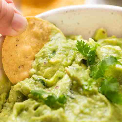 Order Pint of Guacamole (16oz) food online from Salsarita's Fresh Mexican Grill store, Starkville on bringmethat.com