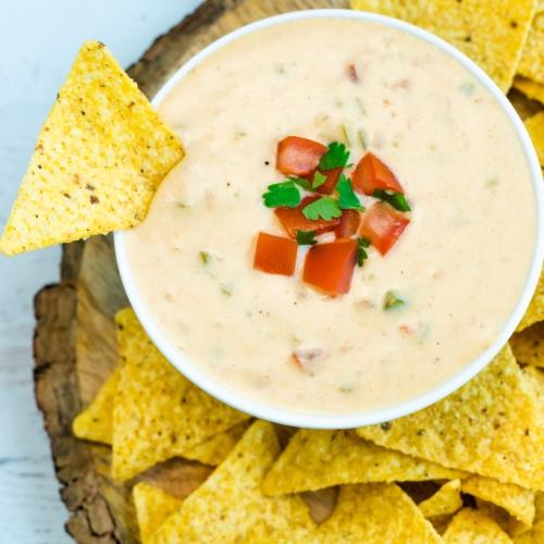 Order Pint of Queso (16oz) food online from Salsarita's Fresh Mexican Grill store, Starkville on bringmethat.com