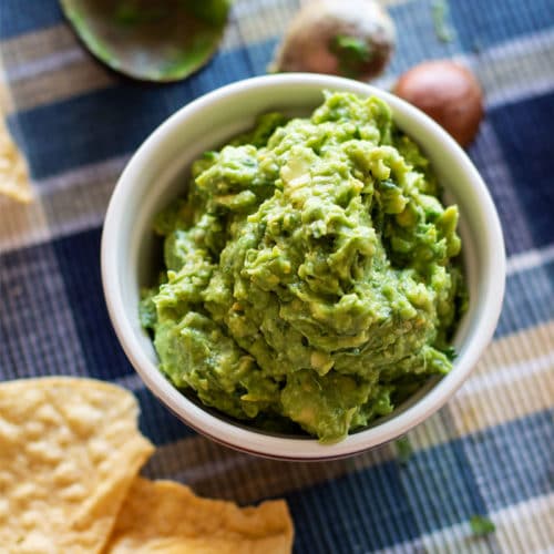 Order Quart of Guacamole (32oz) food online from Salsarita's Fresh Mexican Grill store, Starkville on bringmethat.com