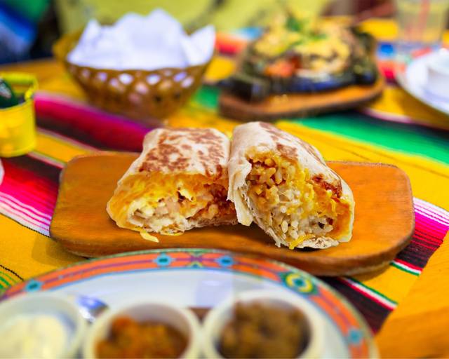 Order Pork Quesorito food online from Salsarita's Fresh Mexican Grill store, Starkville on bringmethat.com