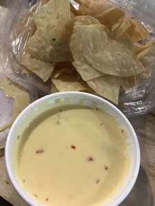 Order 8 oz. Cheese Dip w/ Chips food online from Bandito Burrito Co store, Huntsville on bringmethat.com