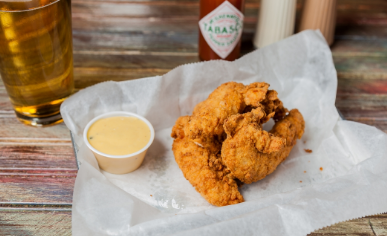 Order CHICKEN FINGER BASKET food online from Cooter Brown's Tavern store, New Orleans on bringmethat.com