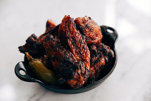 Order Fire-Kissed Wings (10 pieces) Appetizer food online from Fiorella's Jack Stack Barbecue store, Kansas City on bringmethat.com