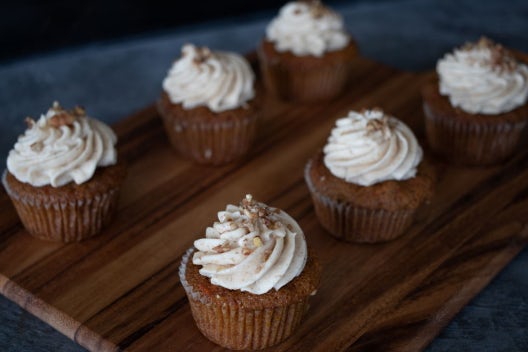 Order Mom's Carrot Cake Cupcake (with Pecans) - 1/2 Dozen food online from Fiorella's Jack Stack Barbecue store, Kansas City on bringmethat.com