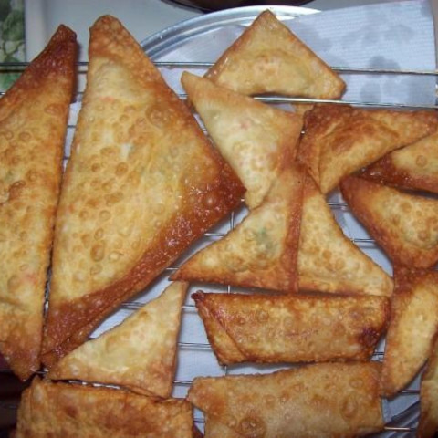 Order Crab Rangoon (12) food online from Empire Wok store, Delmar on bringmethat.com