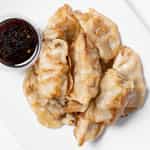 Order A04. Pan Fried or Steamed Dumpling food online from China Buffet store, Madison on bringmethat.com